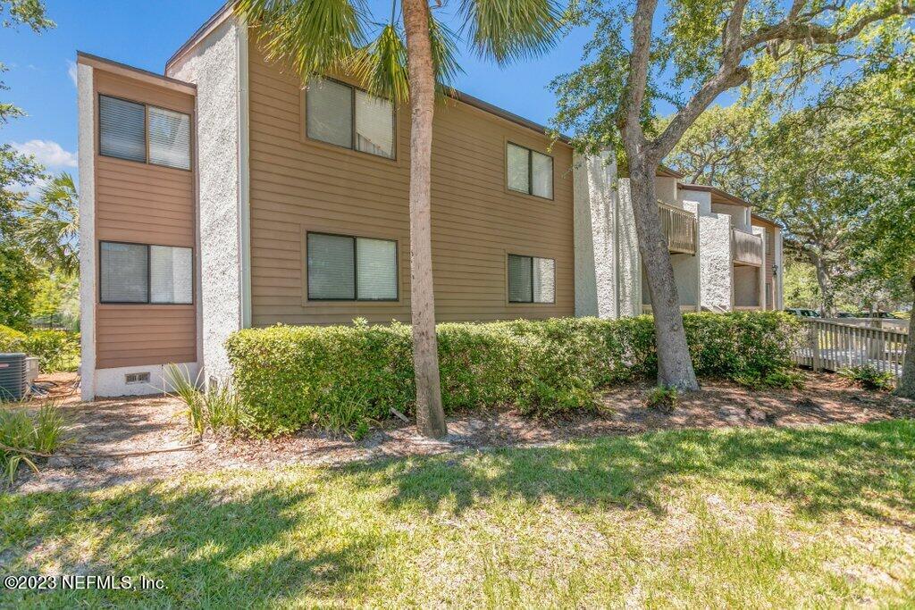 2694 Forest Ridge Drive, Unit 4A Fernandina Beach, FL 32034 - Photo 32 of 38 a view of a house with a yard
