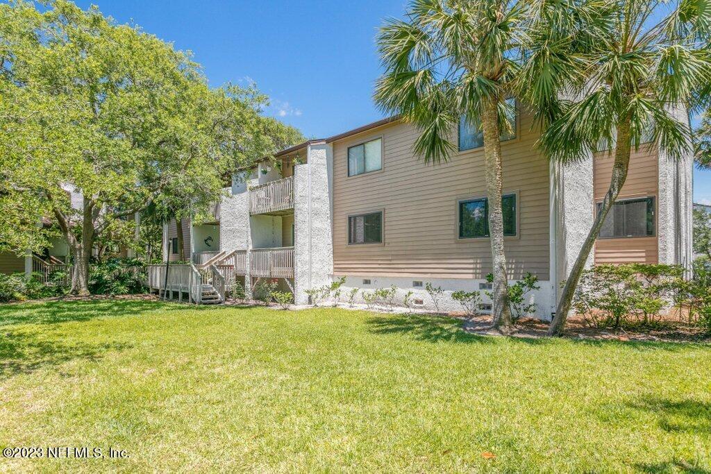 2694 Forest Ridge Drive, Unit 4A Fernandina Beach, FL 32034 - Photo 33 of 38 a front view of house with yard and green space