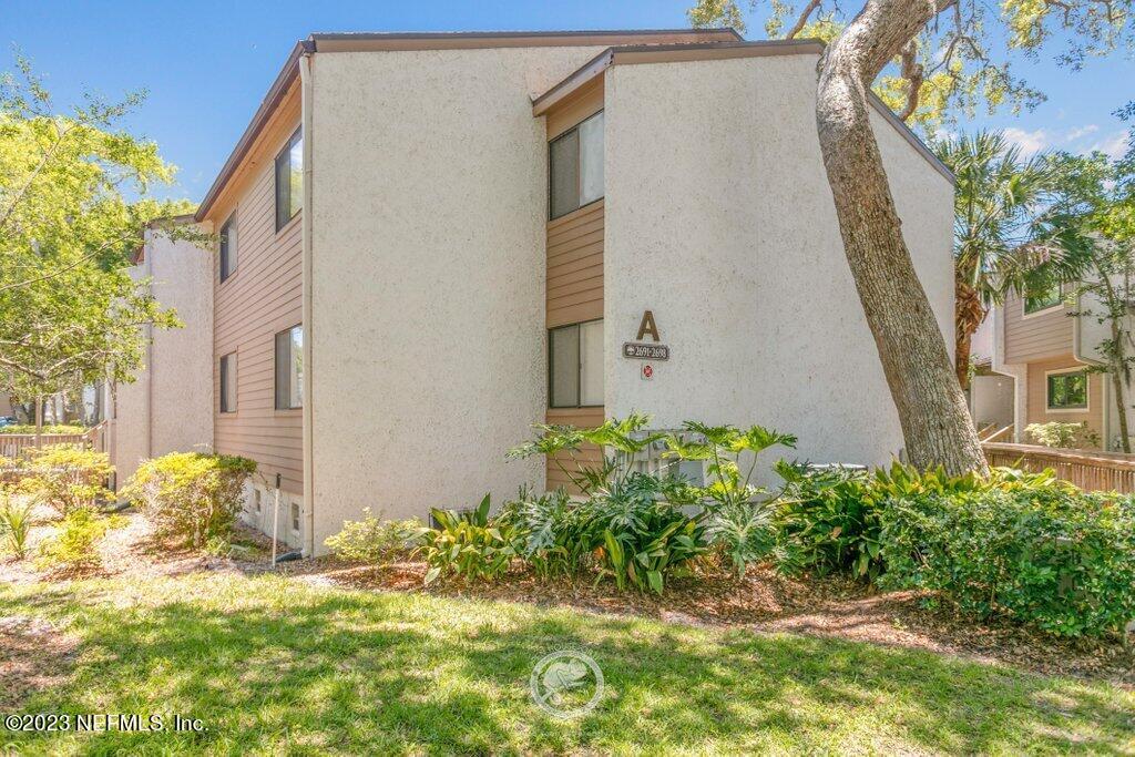 2694 Forest Ridge Drive, Unit 4A Fernandina Beach, FL 32034 - Photo 34 of 38 a view of a house with a backyard