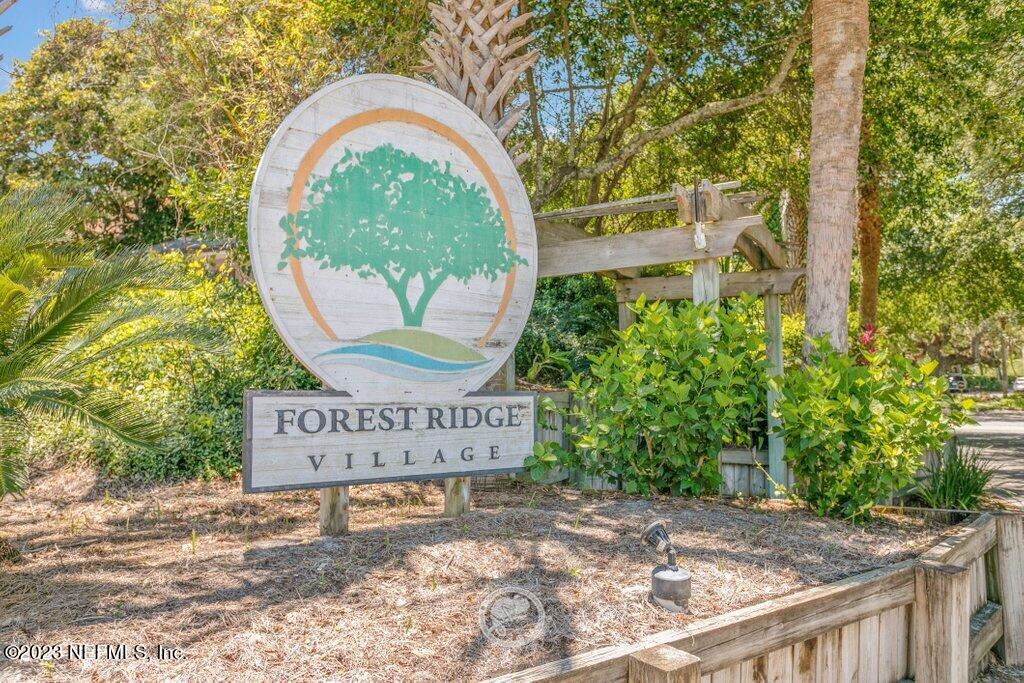 2694 Forest Ridge Drive, Unit 4A Fernandina Beach, FL 32034 - Photo 36 of 38 a sign on the side of a building