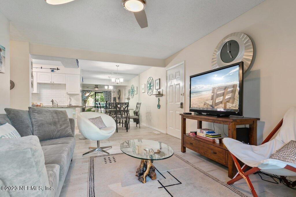 2694 Forest Ridge Drive, Unit 4A Fernandina Beach, FL 32034 - Photo 6 of 38 a living room with furniture and a flat screen tv