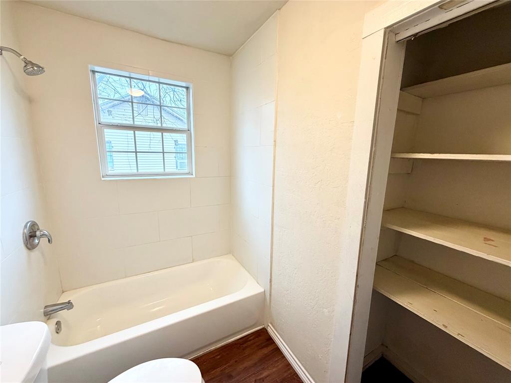 1140 Faulkner Lane Waco, TX 76704 - Photo 13 of 17 a bathroom with a tub and shower