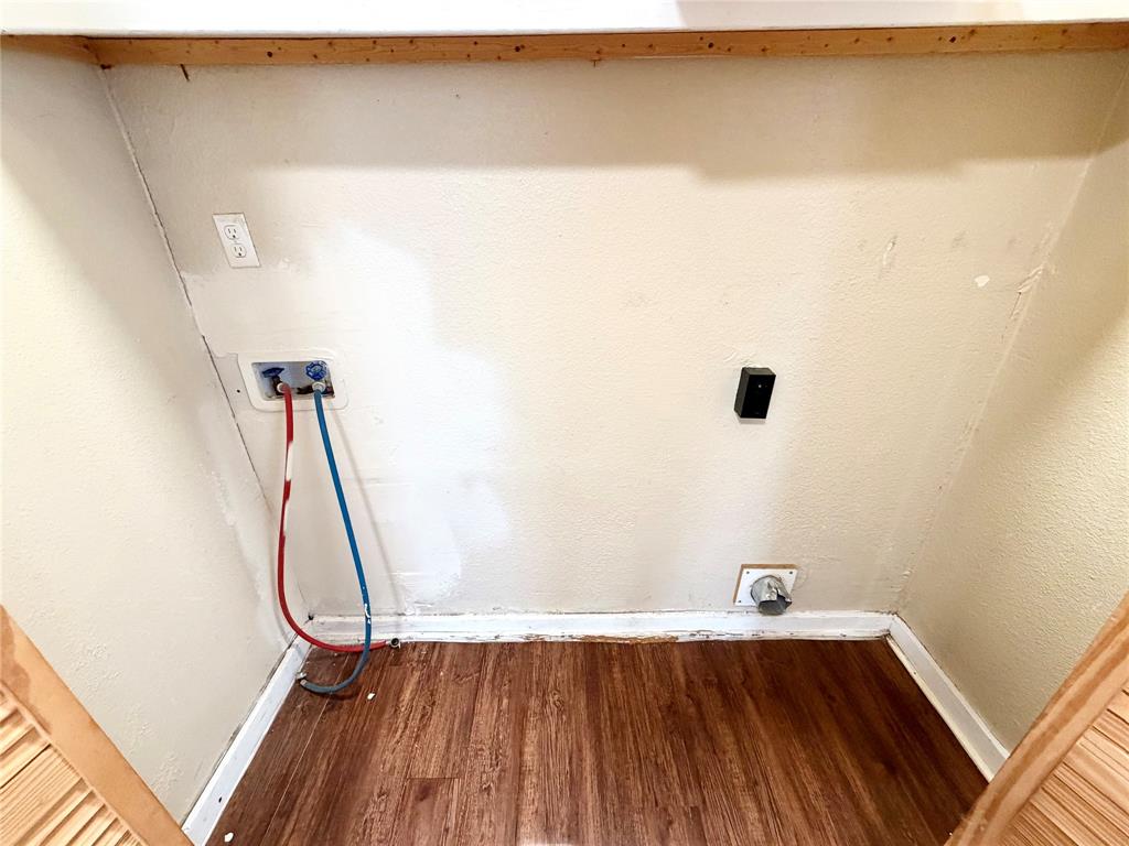 1140 Faulkner Lane Waco, TX 76704 - Photo 5 of 17 a view of a room with wooden floor and white walls