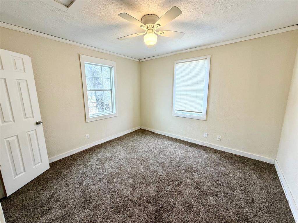 1140 Faulkner Lane Waco, TX 76704 - Photo 10 of 17 a view of an empty room with a window