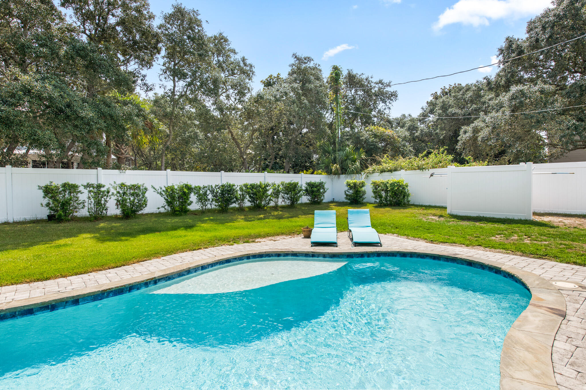 71 Sea Oates Road Santa Rosa Beach, FL 32459 - Photo 36 of 59 a view of a swimming pool with a yard