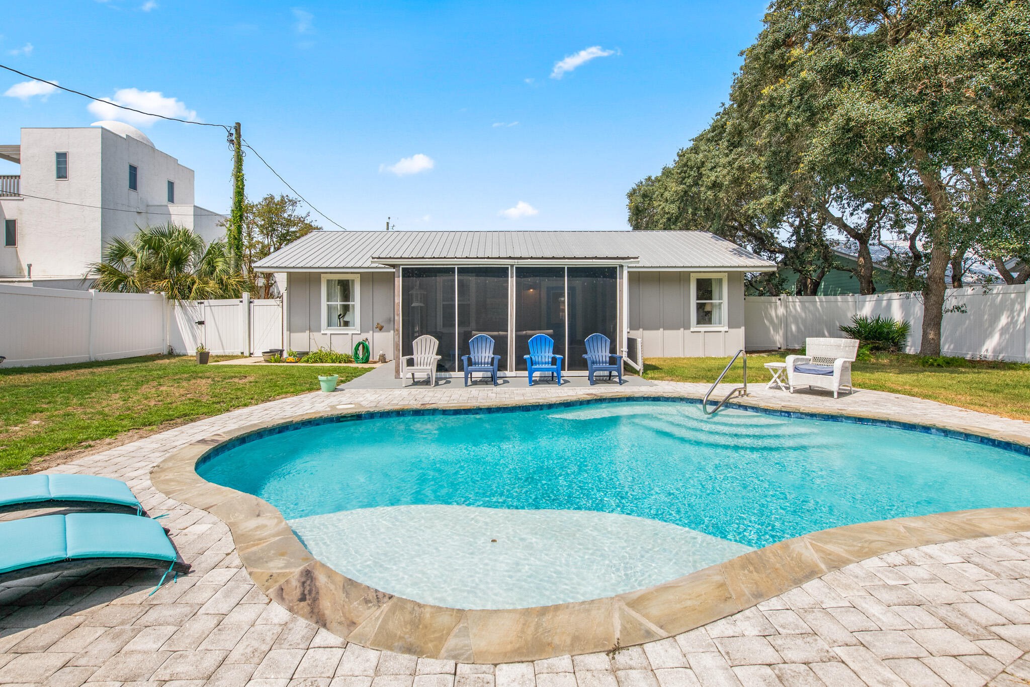71 Sea Oates Road Santa Rosa Beach, FL 32459 - Photo 38 of 59 a view of a house with swimming pool and a yard