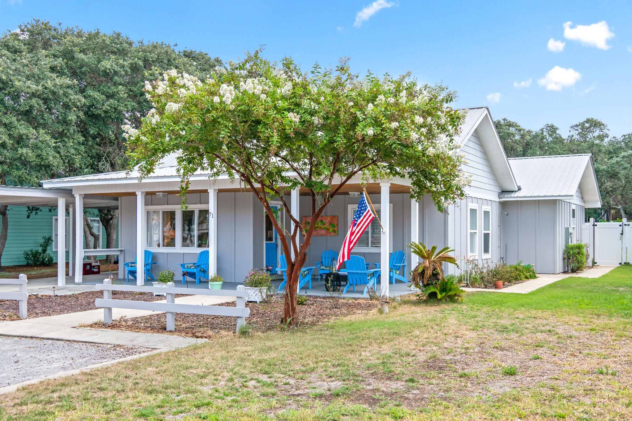 71 Sea Oates Road Santa Rosa Beach, FL 32459 - Photo 53 of 59 a view of a house with backyard and sitting area