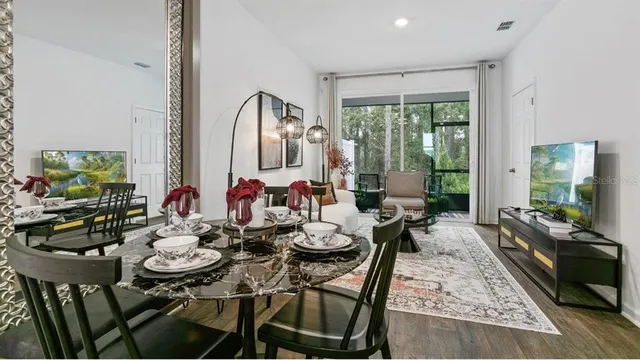 a view of a dining room with furniture window and outside view