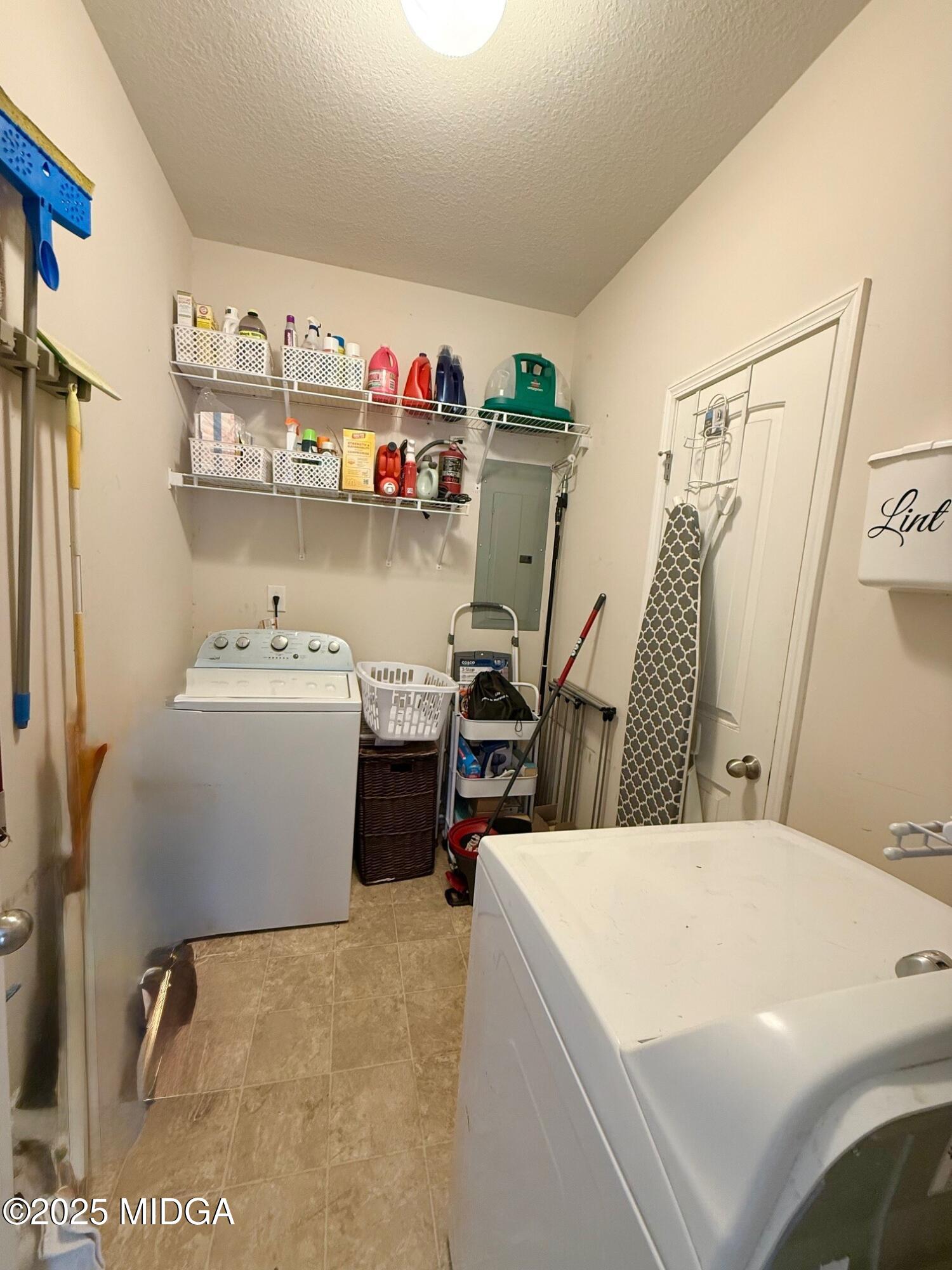 149 Presidents Way Forsyth, GA 31029 - Photo 13 of 26 a utility room with sink dryer and washer