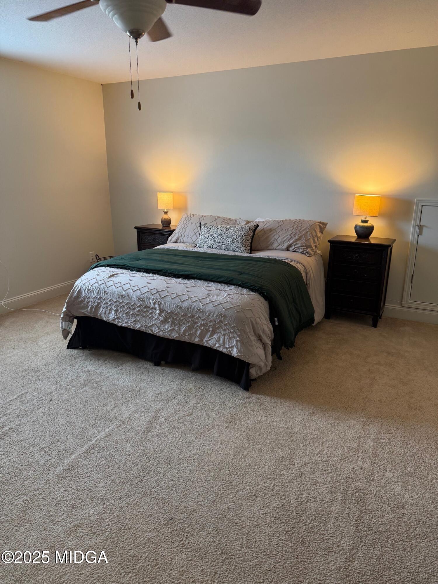 149 Presidents Way Forsyth, GA 31029 - Photo 14 of 26 a bedroom with a bed and lamp