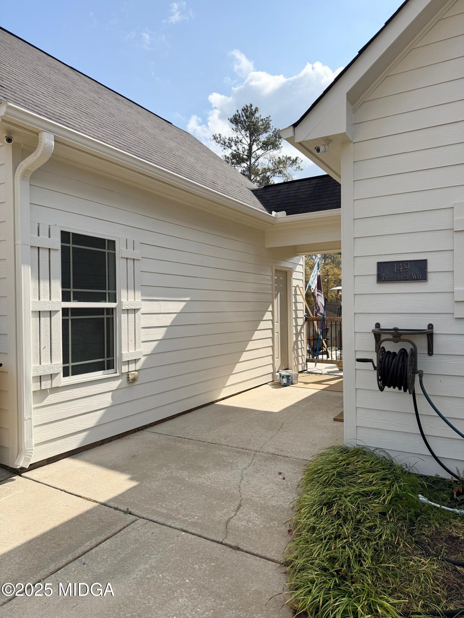 149 Presidents Way Forsyth, GA 31029 - Photo 17 of 26 a view of a porch with a table and chairs