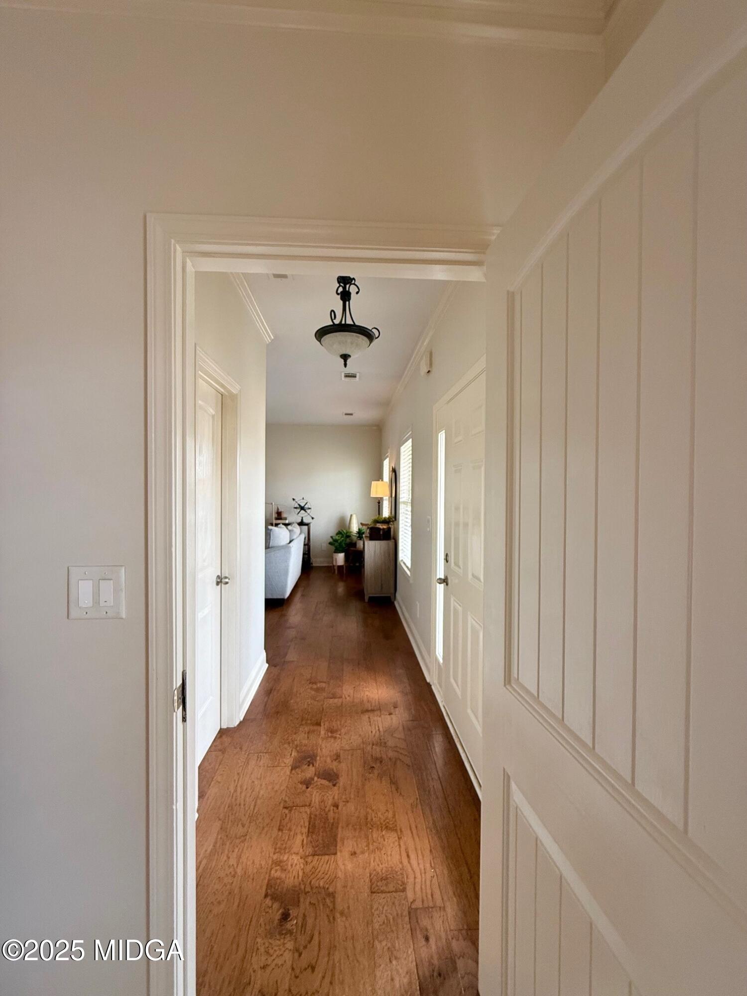 149 Presidents Way Forsyth, GA 31029 - Photo 2 of 26 a view of a hallway with a livingroom and a chandelier