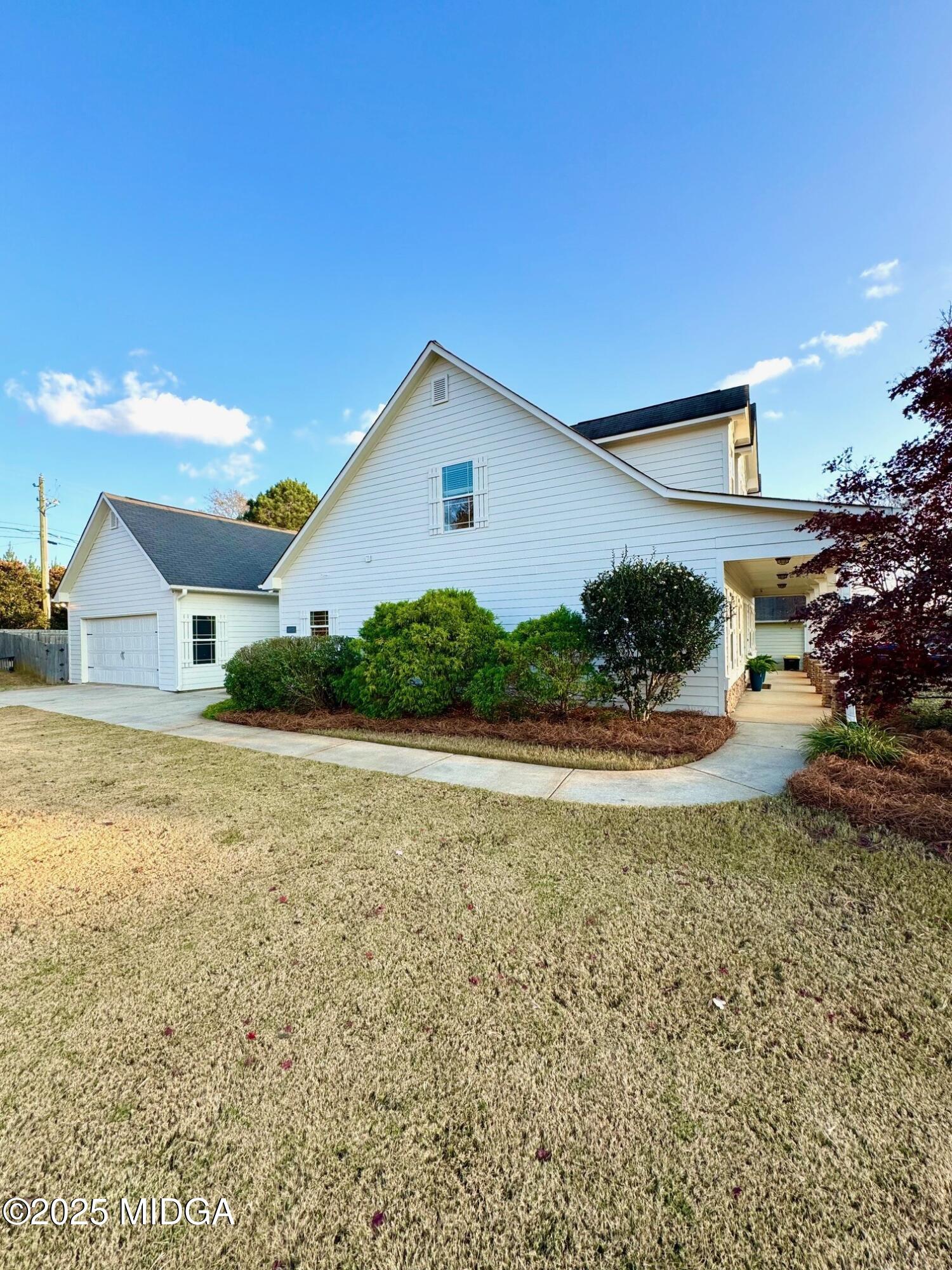 149 Presidents Way Forsyth, GA 31029 - Photo 24 of 26 a view of a house with a yard