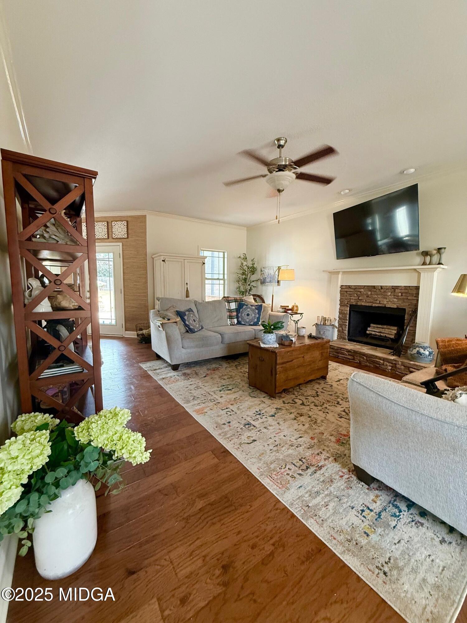 149 Presidents Way Forsyth, GA 31029 - Photo 3 of 26 a living room with furniture fireplace and a flat screen tv
