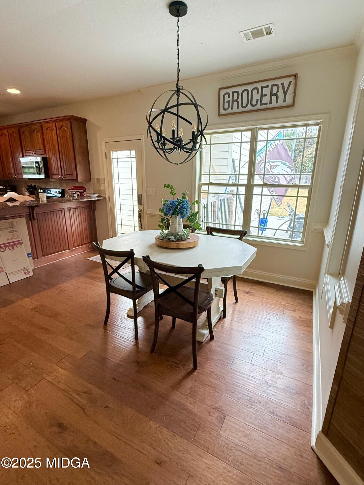 149 Presidents Way Forsyth, GA 31029 - Photo 4 of 26 a view of a dining room with furniture window and wooden floor