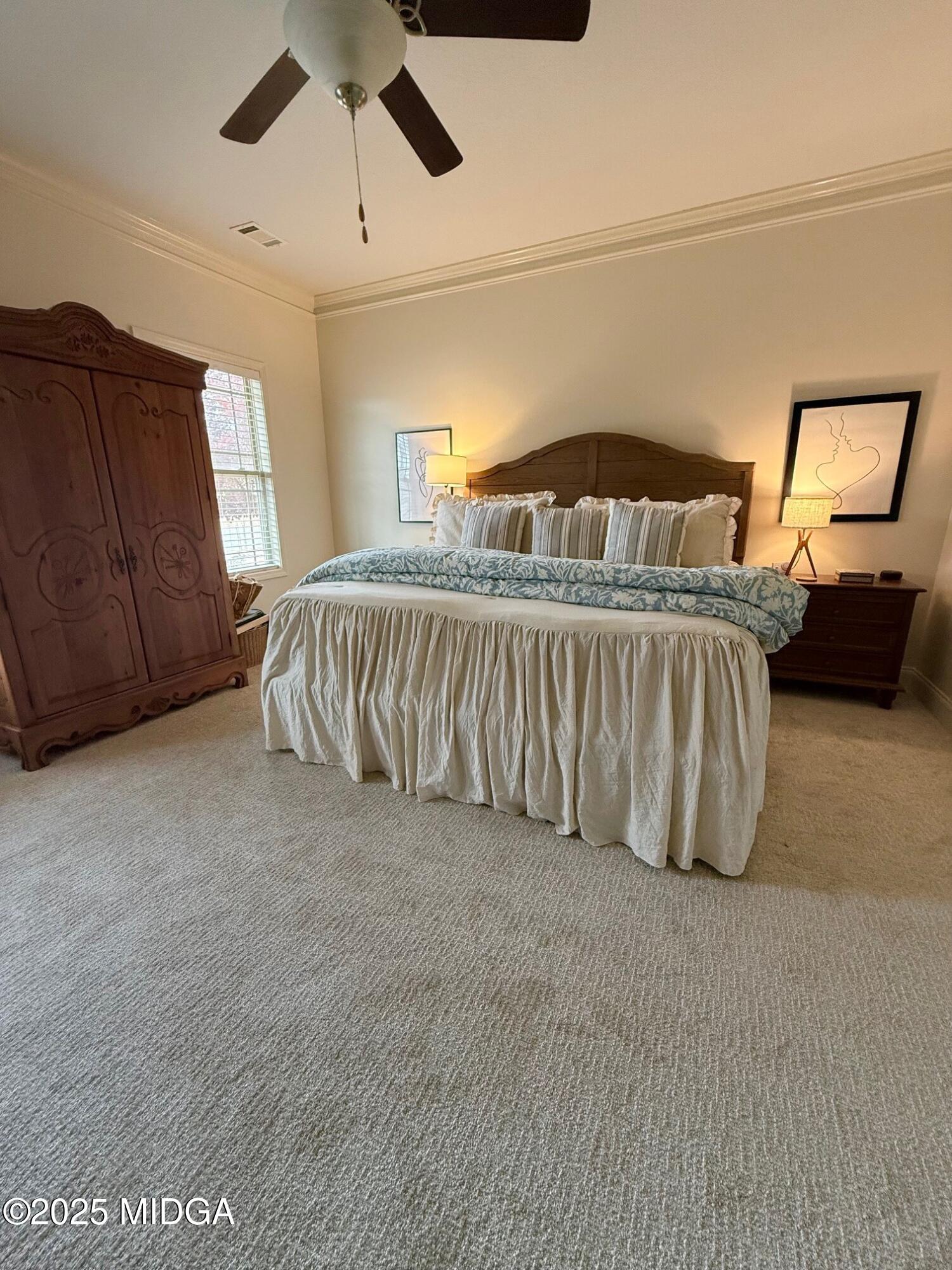 149 Presidents Way Forsyth, GA 31029 - Photo 8 of 26 a spacious bedroom with a bed and window