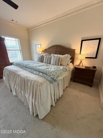 a bedroom with bed and a window