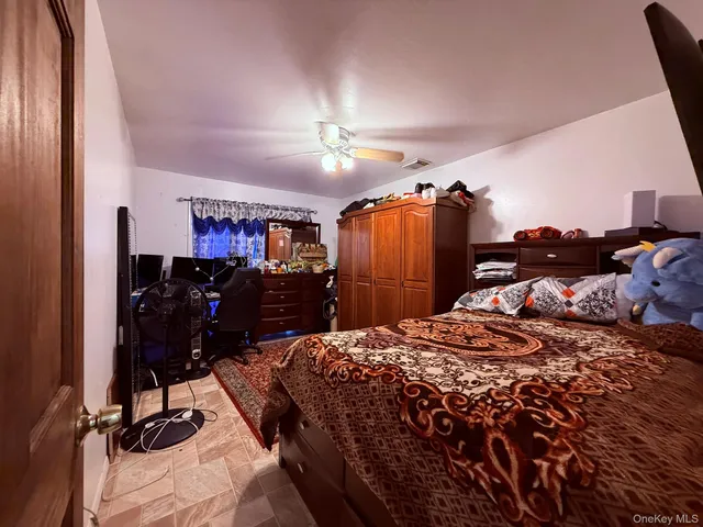 a bed room with a bed and a desk