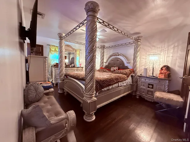 a living room with furniture fireplace and wooden floor