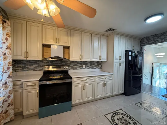 a kitchen with a stove and a refrigerator