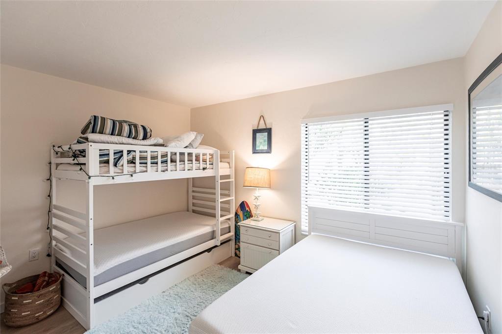 2955 North Beach Road, Unit B612 Englewood, FL 34223 - Photo 16 of 24 a bedroom with a bed and a window