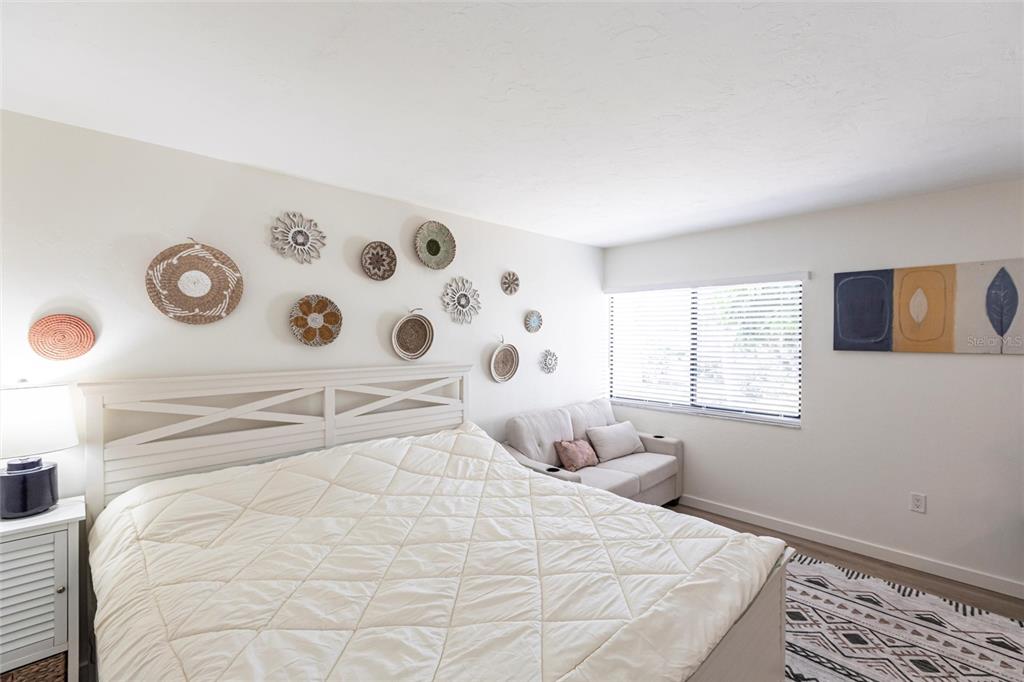 2955 North Beach Road, Unit B612 Englewood, FL 34223 - Photo 21 of 24 a large white bed in a white room