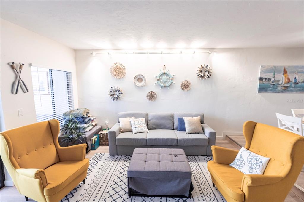 2955 North Beach Road, Unit B612 Englewood, FL 34223 - Photo 6 of 24 a living room with furniture and painting on the wall