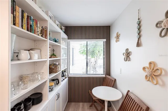 a bathroom with a sink a toilet and a window