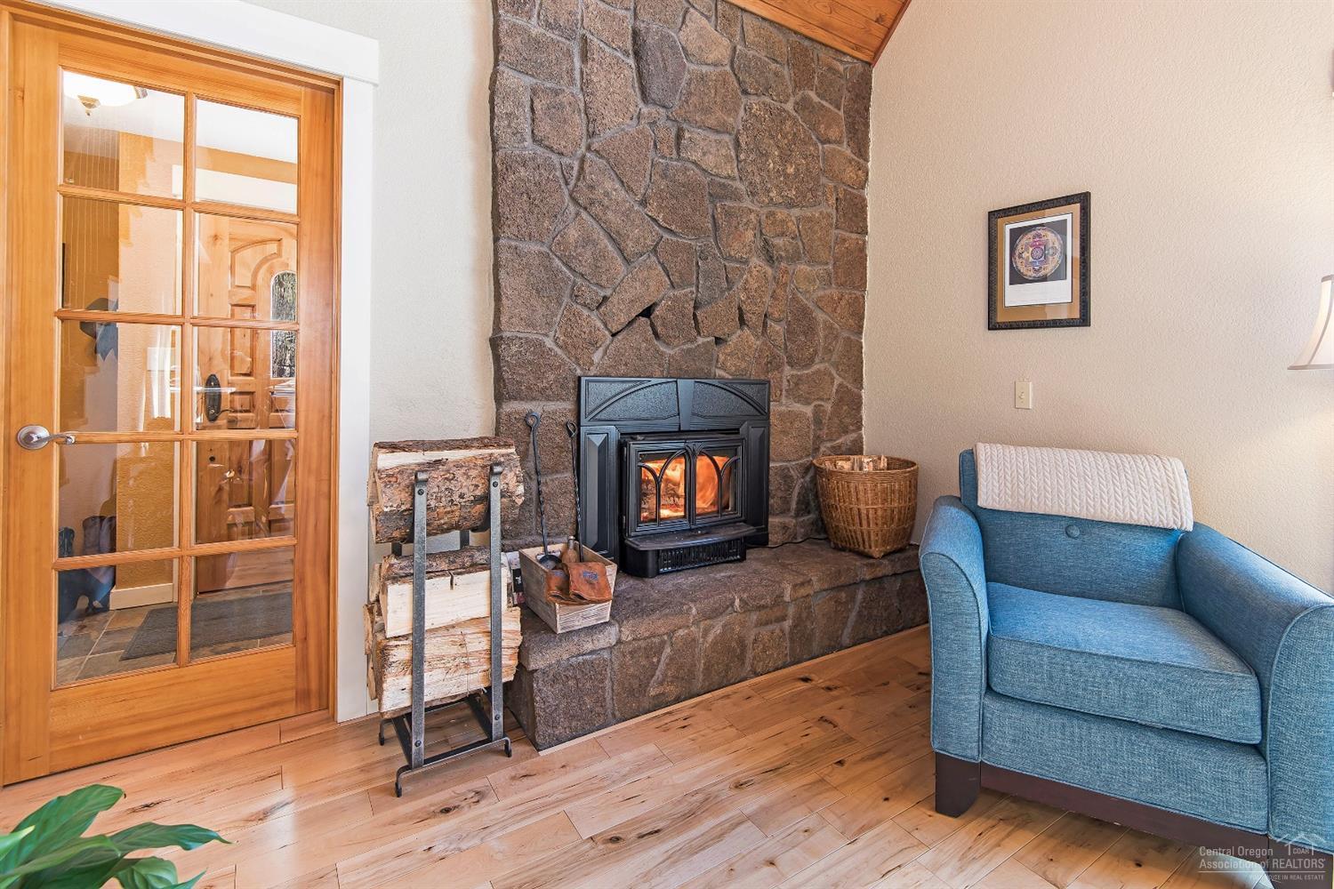 16033 Cattle Drive Road Sisters, OR 97759 - Photo 6 of 22 a living room with furniture and a fireplace