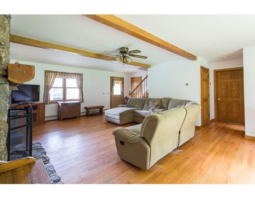197 Douglas Road Warren, MA 01083 - Photo 11 of 28 a living room with furniture and a wooden floor