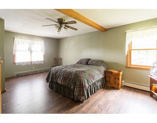 197 Douglas Road Warren, MA 01083 - Photo 13 of 28 a bedroom with a bed and a window