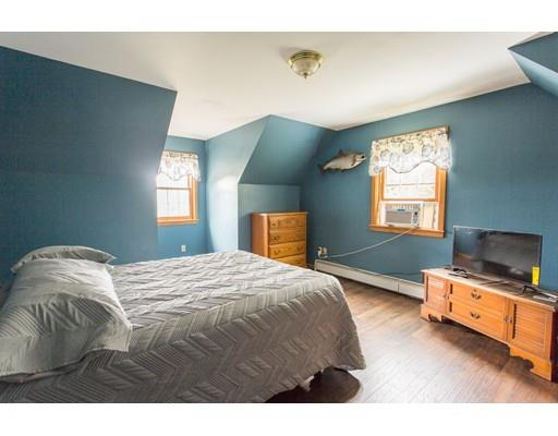 197 Douglas Road Warren, MA 01083 - Photo 16 of 28 a bedroom with a bed and window