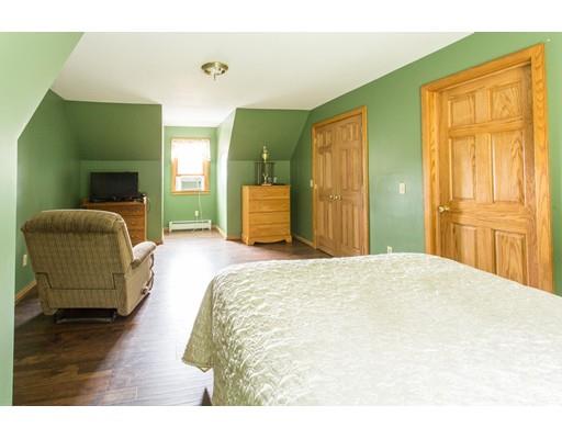 197 Douglas Road Warren, MA 01083 - Photo 17 of 28 a bedroom with a bed and mirror