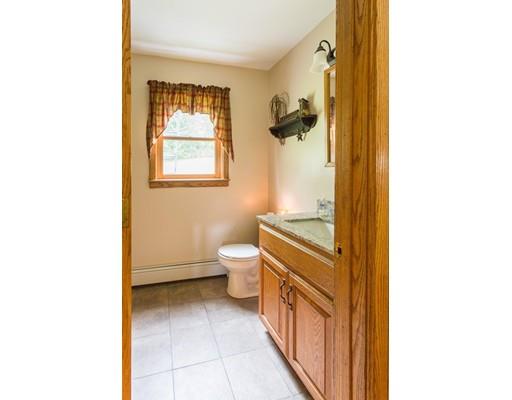 197 Douglas Road Warren, MA 01083 - Photo 20 of 28 a bathroom with a toilet sink and mirror