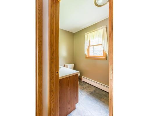 197 Douglas Road Warren, MA 01083 - Photo 22 of 28 a view of a bathroom with sink and mirror