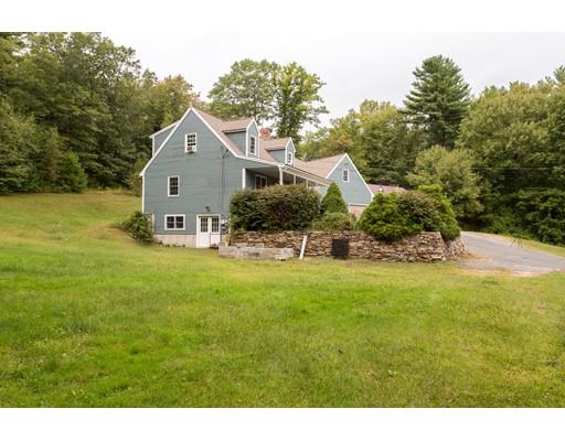 197 Douglas Road Warren, MA 01083 - Photo 25 of 28 a backyard of a house with table and chairs