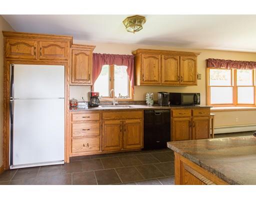 197 Douglas Road Warren, MA 01083 - Photo 3 of 28 a kitchen with a refrigerator sink and cabinets