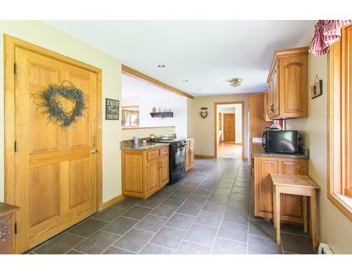 197 Douglas Road Warren, MA 01083 - Photo 5 of 28 a kitchen with stainless steel appliances granite countertop a stove a sink and a refrigerator