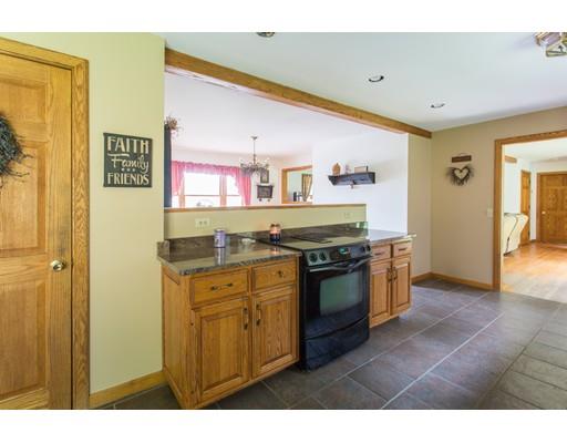197 Douglas Road Warren, MA 01083 - Photo 6 of 28 a kitchen with stainless steel appliances granite countertop a stove and a refrigerator