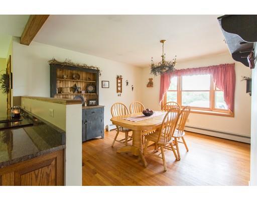 197 Douglas Road Warren, MA 01083 - Photo 7 of 28 a view of a dining room with furniture and a chandelier