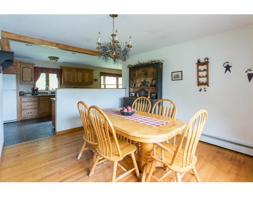 197 Douglas Road Warren, MA 01083 - Photo 8 of 28 a view of a dining room with furniture wooden floor and chandelier