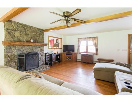197 Douglas Road Warren, MA 01083 - Photo 10 of 28 a living room with furniture and a fireplace
