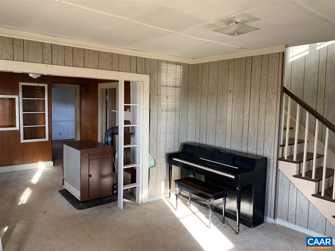 2615 Dunnes Shop Road Ruckersville, VA 22968 - Photo 4 of 22 a view of a livingroom with furniture and staircase