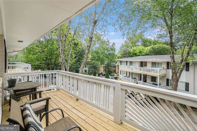 a view of a two chairs in the balcony