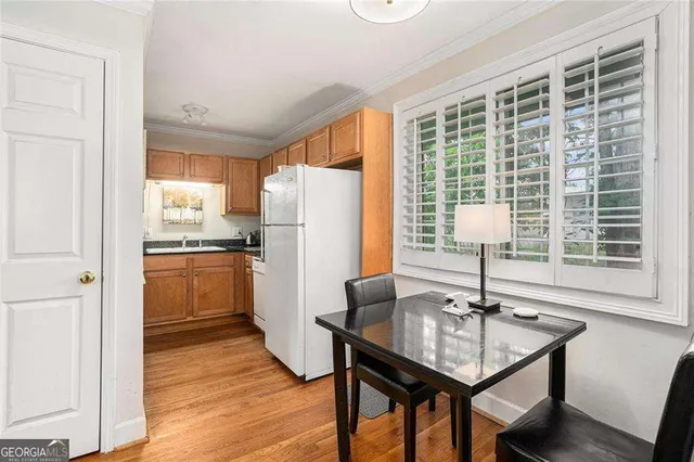 a kitchen with a table and chairs