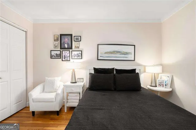 a living room with furniture and a painting on the wall