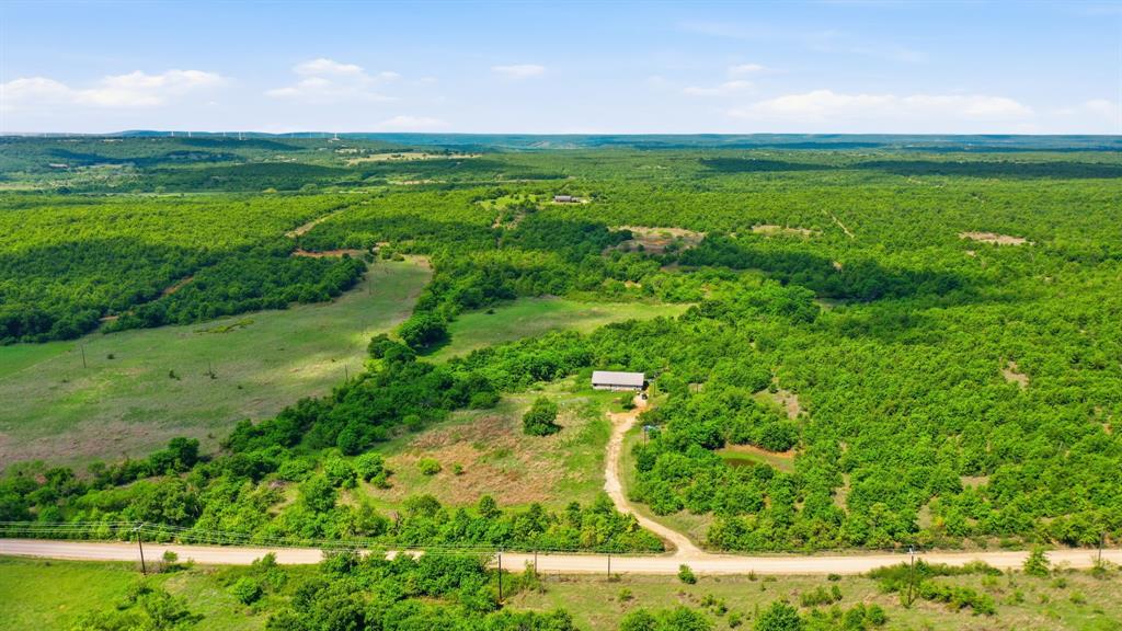 3180 Rock Creek Road Jacksboro, TX 76458 - Photo 1 of 17 a view of a garden with a building