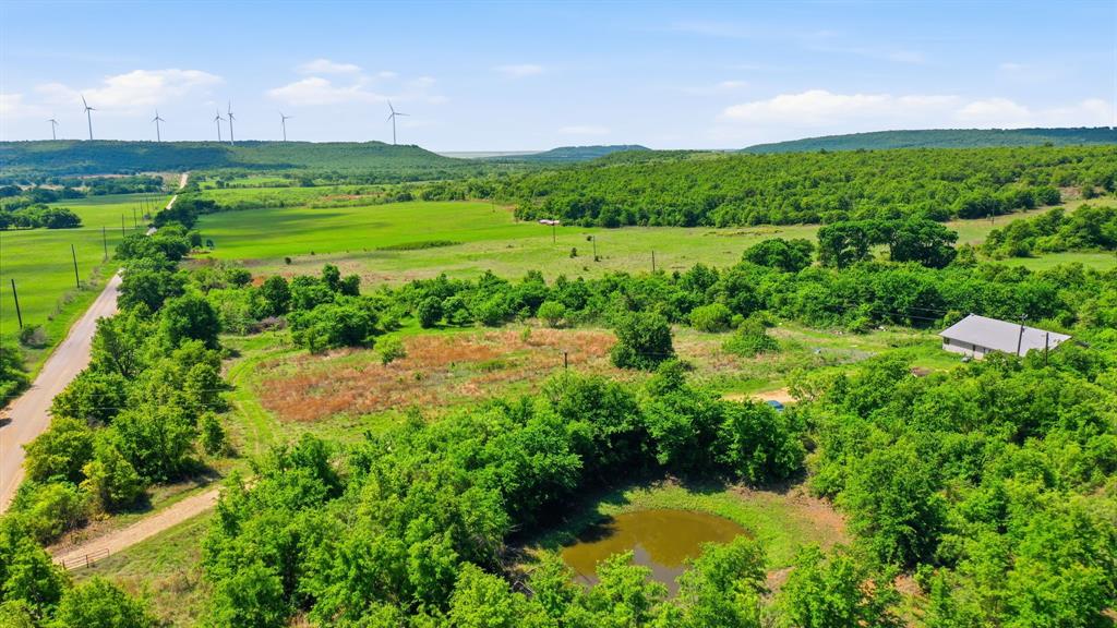 3180 Rock Creek Road Jacksboro, TX 76458 - Photo 15 of 17 a view of a lush green space