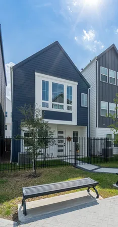 a view of a house with a yard and a large window