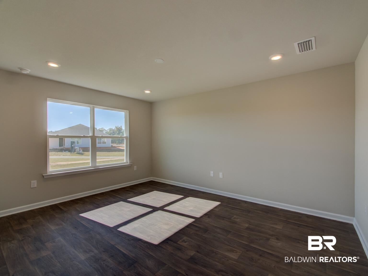 23953 Citation Loop Daphne, AL 36526 - Photo 17 of 49 Empty room with dark wood-style flooring and recessed lighting